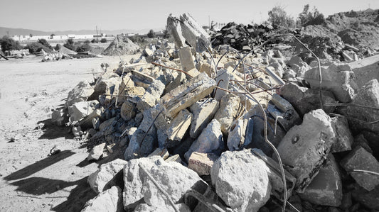 Broken concrete rubble from demolition project with jagged edges