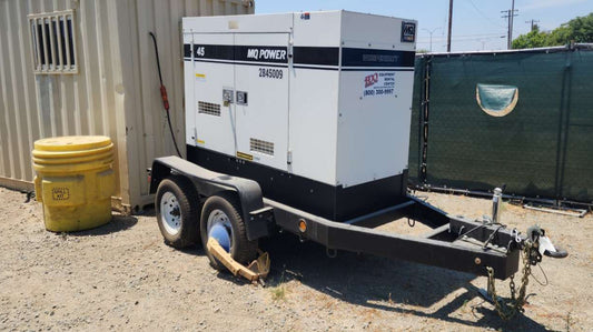 Mobile power generator on a trailer with Spill Kit staged nearby.